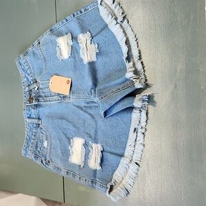 Distressed blue Jean shorts.